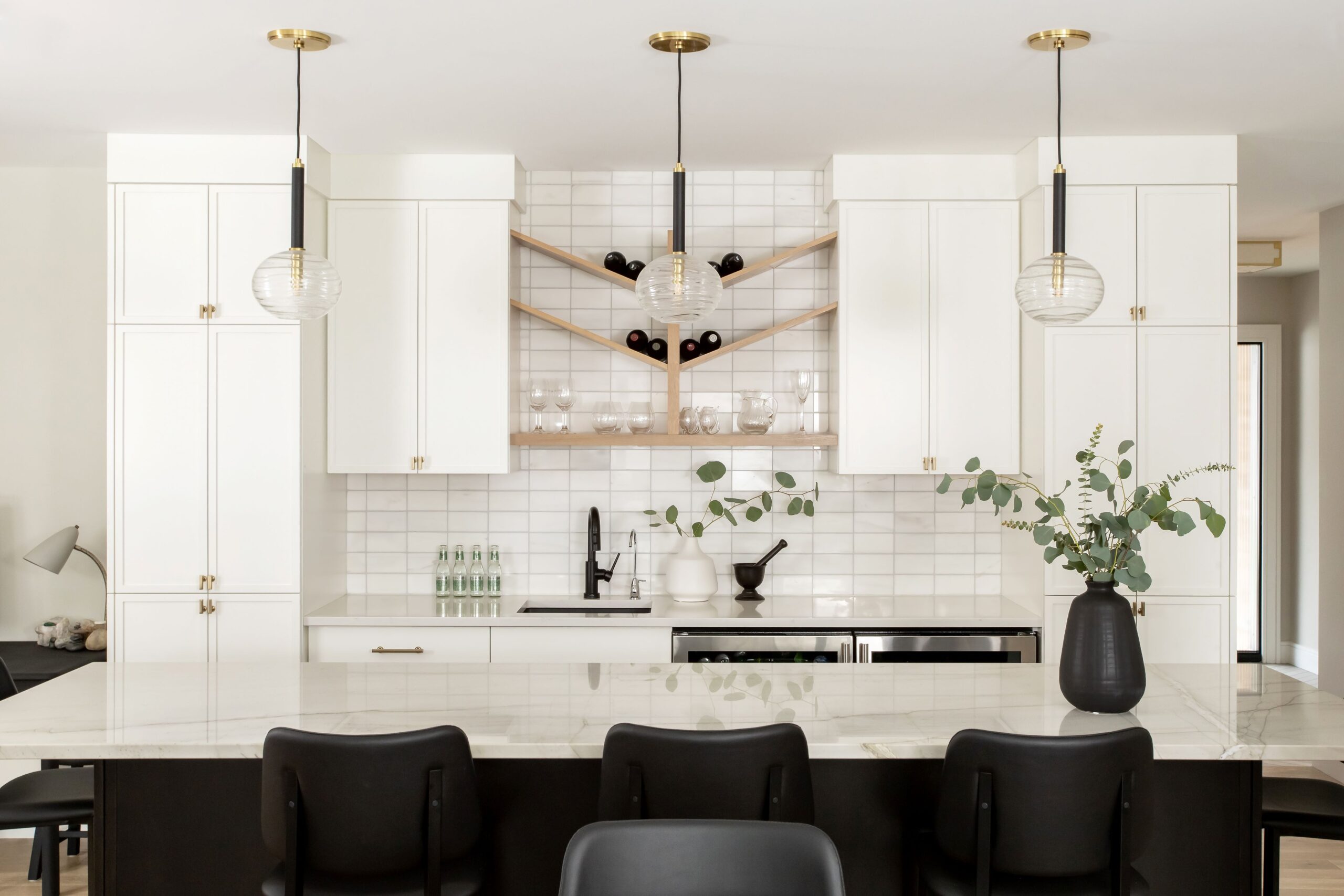 Faircourt Kitchen 3 Faircourt Kitchen Remodel, Delta Trinsic Faucet, Quartzite, white kitchen, black kitchen, wine shelf, white oak, custom design, brass knobs, black sink, Robert Abby Lighting, brass light fixtures, Hudson Valley Lighting, Marble backsplash, bar stools, island, modern, contemporary, bar fridges, Hanstone, Montauk, bar sink, luxury kitchensJennifer Teeple Design Inc. London Ontario